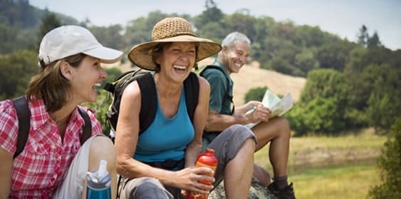 happy family taking a break while hiking